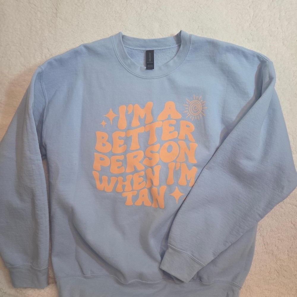 Fun sweatshirt with 'I'm a better person when I'm tan' because you want summer